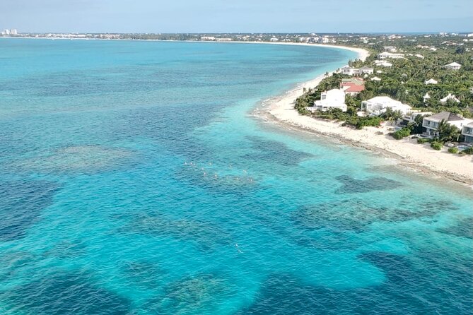 1 Hour Private Parasailing Charter, Grace Bay, Providenciales - Photos, music, and the wet-or-dry choice