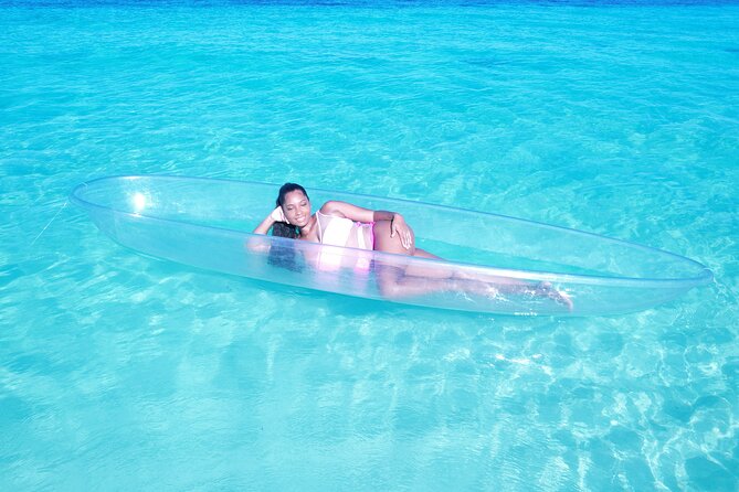 Clear Kayak Drone Photoshoot , Providenciales, Turks and Caicos - Getting into the clear-bottom kayak