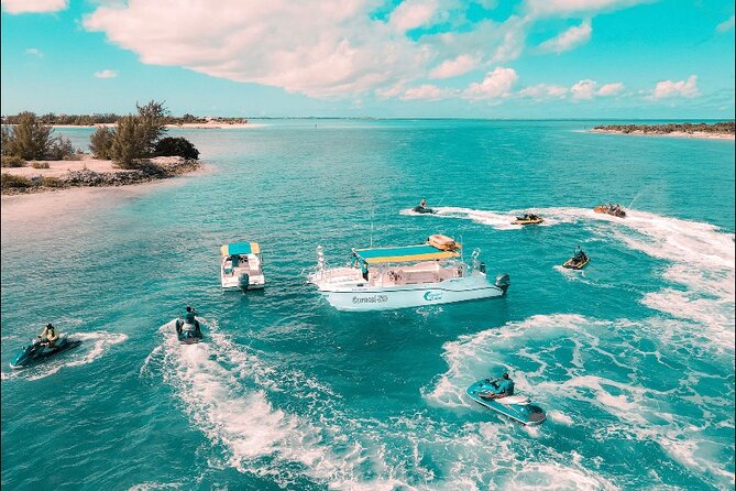 Jet Skiing around La famille ship and smaller pristine cays - Weather can change the route