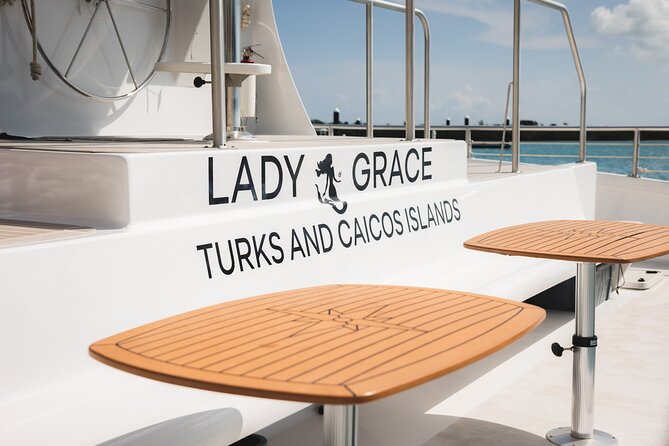 Lady Grace Signature Catamaran Sunset Sail from Ritz-Carlton - Boarding Lady Grace barefoot